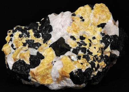 Gemmy yellow willemite crystals, franklinite crystals and calcite Gemmy yellow willemite crystals, franklinite crystals and calcite