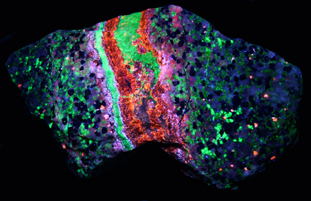 Fluorescent sphalerite vein under longwave UV light Fluorescent sphalerite vein under longwave UV light