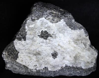 Aragonite coating on calcite / willemite / franklinite ore, Buckwheat Dump Franklin