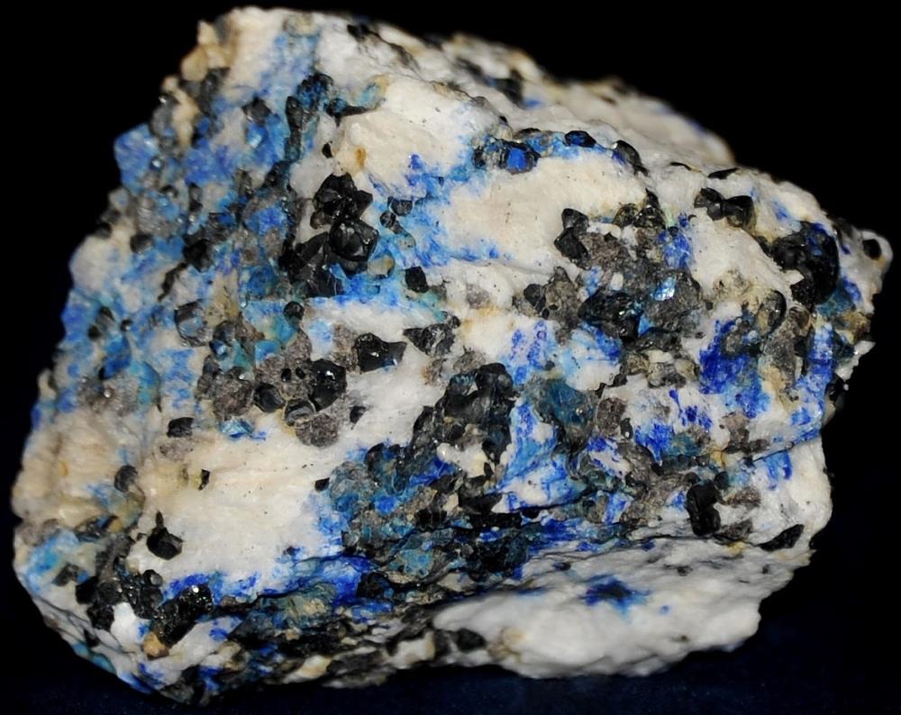 Azurite, calcite, franklinite and willemite, from Sterling Hill Mine, NJ.