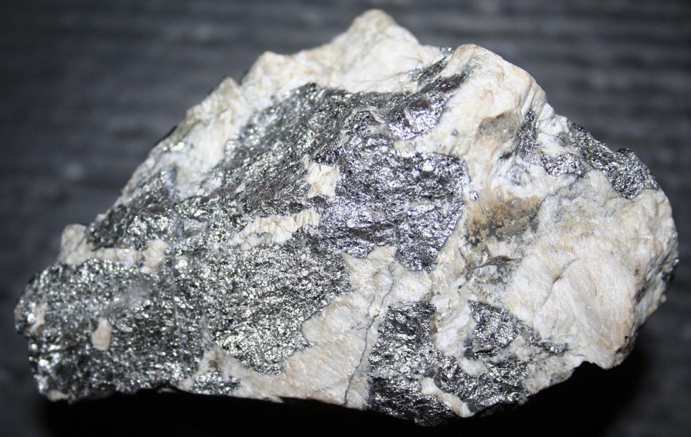 Silver metallic löllingite with calcite Sterling Hill Mine