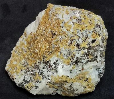 Vesuvianite, with calcite, and hendricksite mica, from Franklin, New Jersey
