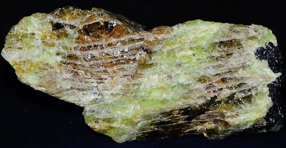 Gemmy root beer and green willemite, minor franklinite from Franklin, NJ.