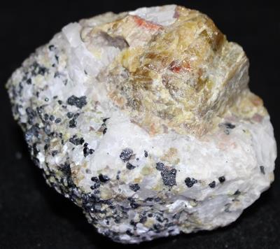 Yellow willemite, calcite and franklinite, from Franklin, NJ.