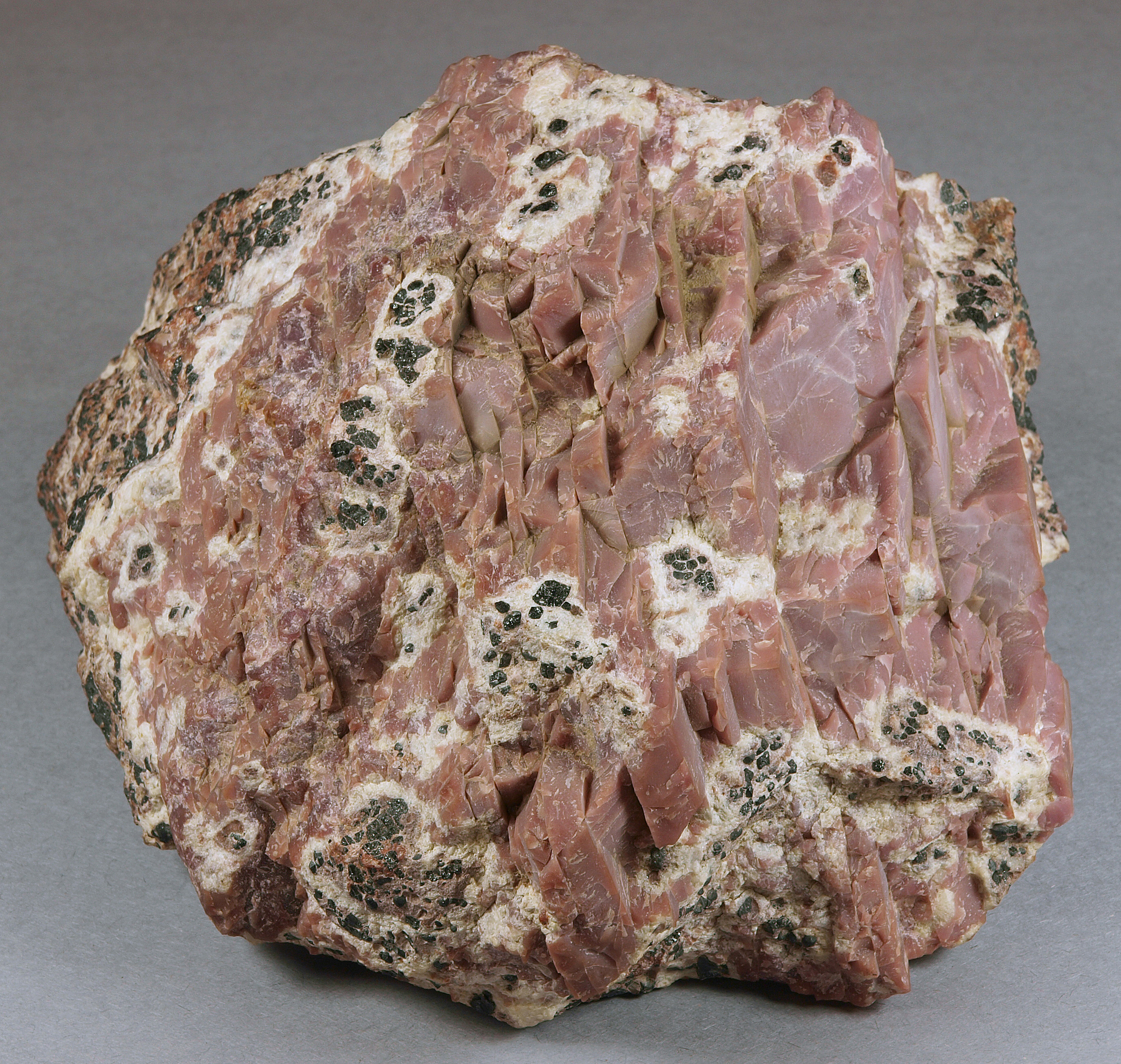 Richly colored sussexite mass in lean calcite-franklinite-willemite ore, Sterling mine, Ogdensburg