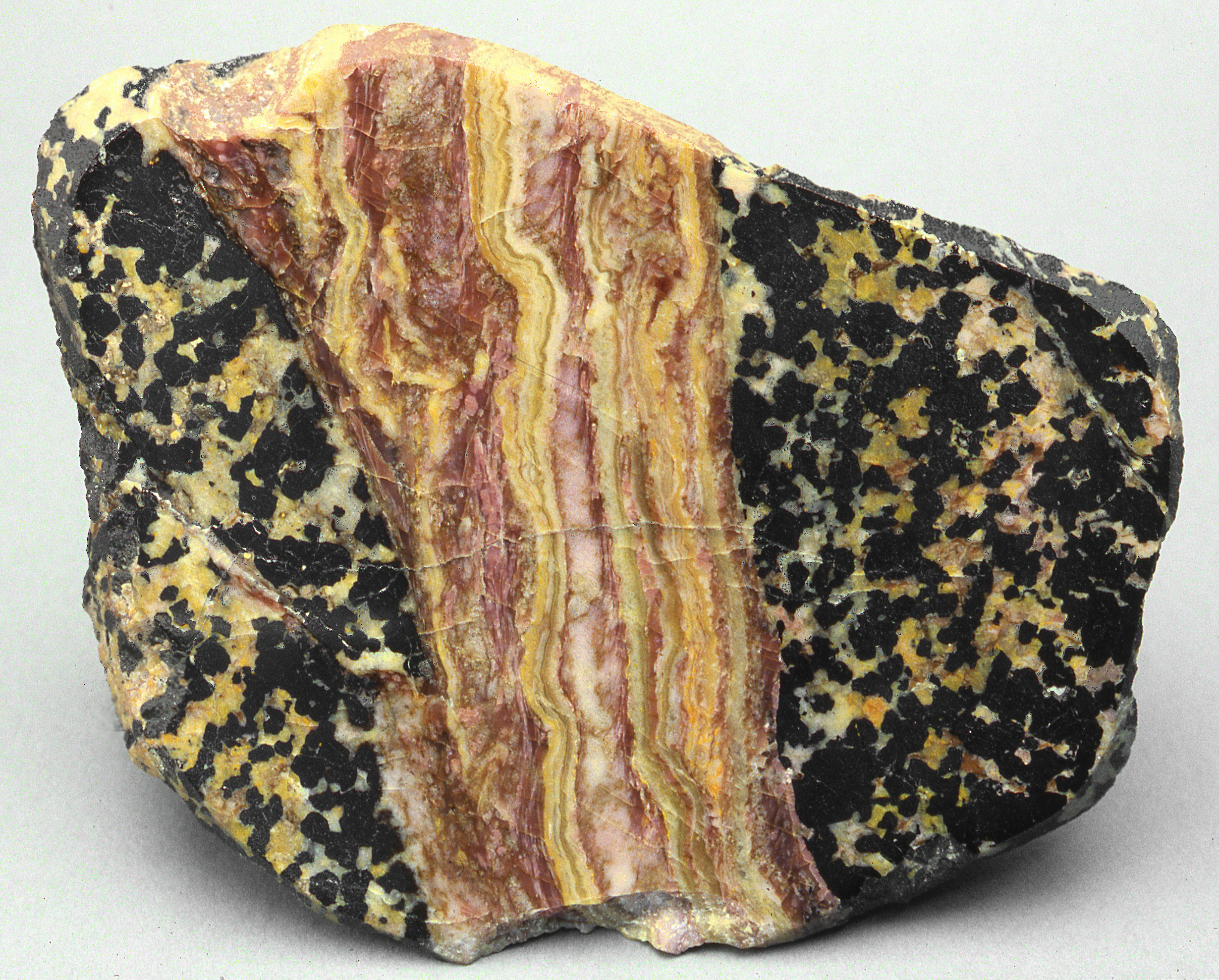 Pink sussexite, yellow willemite, calcite, granular franklinite-willemite ore, Franklin mine, Franklin