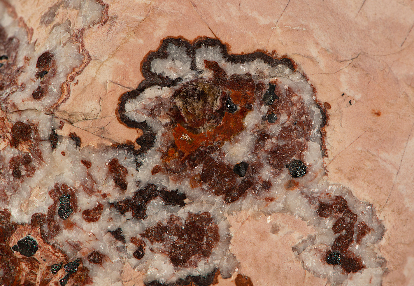 Pale pink sussexite, hematite-strained ore, calcite, Sterling mine, Ogdensburg